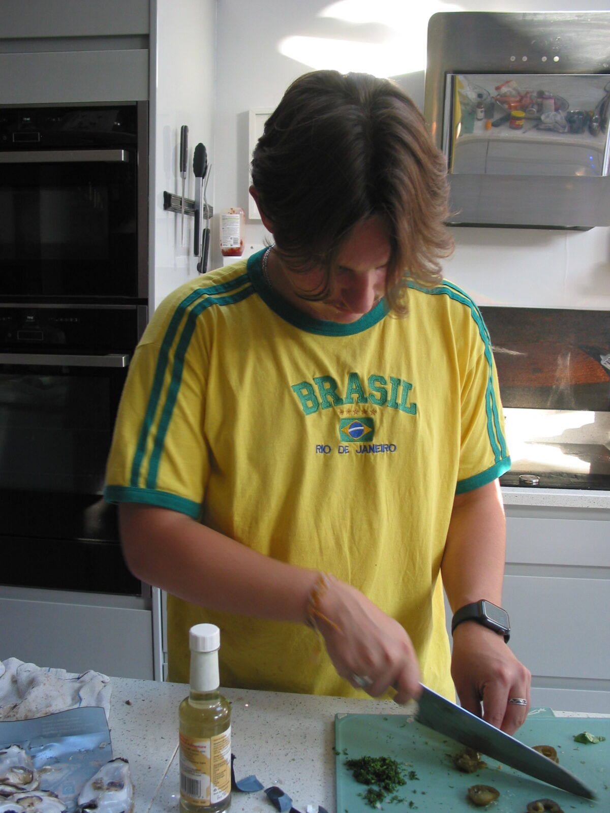 Harry Hannan chopping jalapenos and coriander