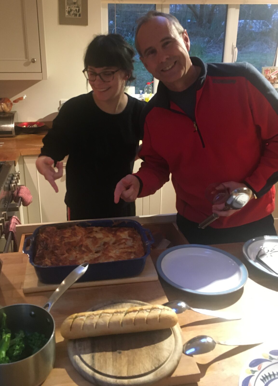 Lotte and her dad point, triumphantly, to their homemade tuna pasta bake. 