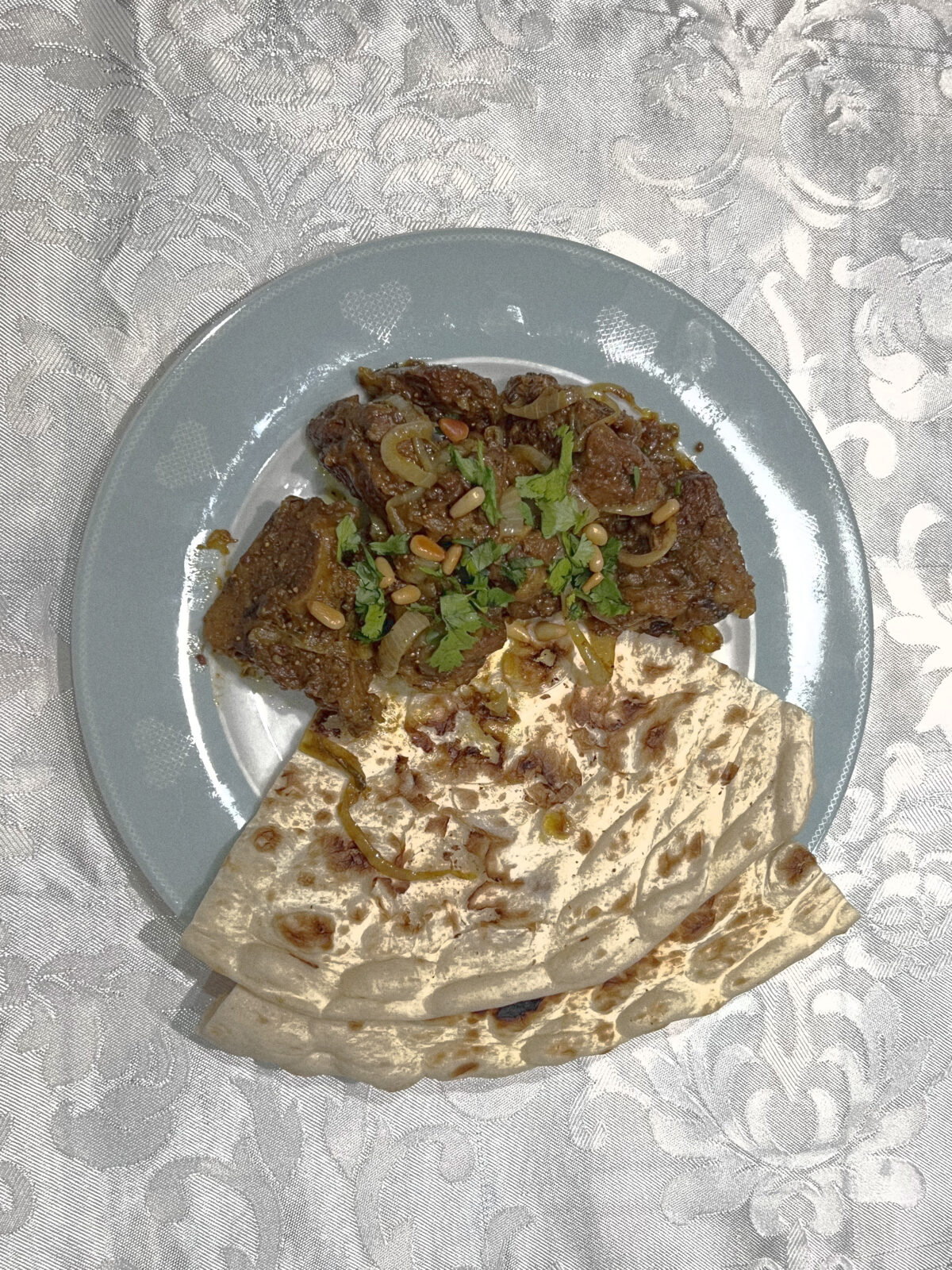 Tagine and flatbread on a plate